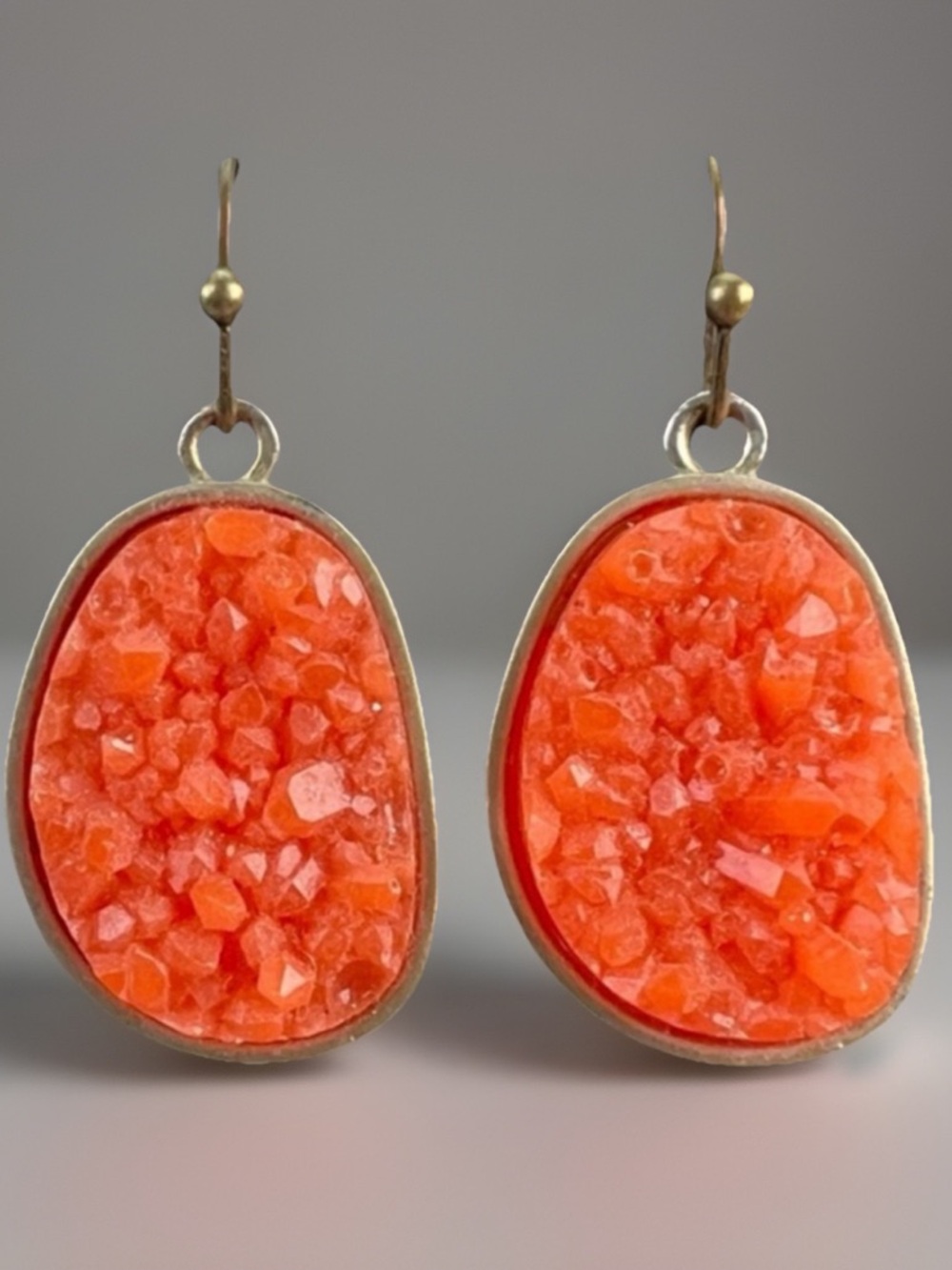 Brasstone light orange raised costume pierced earrings